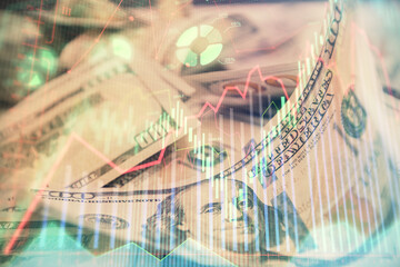 Double exposure of forex graph drawing over us dollars bill background. Concept of financial markets.