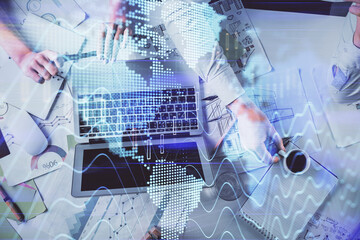 Double exposure of man and woman working together and financial graph hologram. Business concept. Computer background.