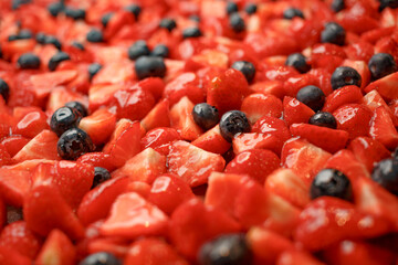 red cut berries in syrup