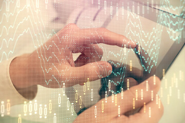 Multi exposure of man's hands holding and using a phone and financial chart drawing. Market analysis concept.