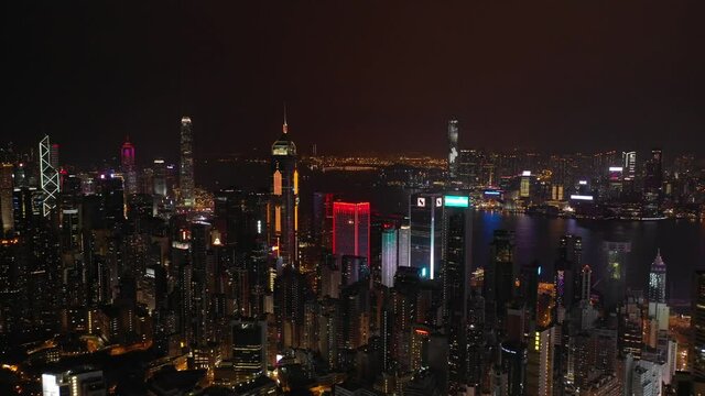 night time illuminated hong kong city downtown aerial panorama 4k
