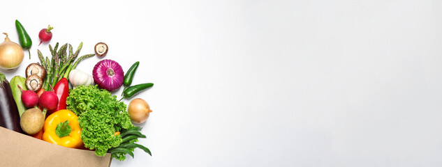 Many fresh different vegetables on light background, top view with space for text. Banner design