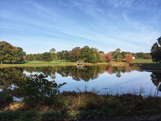 Spanning Pond / Lake / Riverview / Creek with Conestoga Burr Arch Covered Bridge Exeter Town Country Club Rhode Island RI USA olf, Queen River. Rural Landscape of Local Park Outdoor View. Mill History