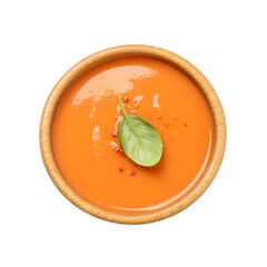 Tasty creamy pumpkin soup with basil in bowl on white background, top view