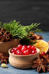 Composition with mulled wine ingredients on blue wooden table, closeup