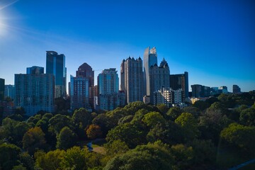 Fototapeta na wymiar Beautiful aerial shot of Piedmont park and Atlanta skyline shot during golden hour by drone