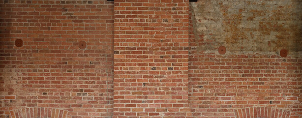 red brick wall background showing grungy texture and patchwork