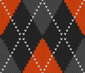 Knitted argyle Halloween pattern. Wool knitinng. Scottish plaid in orange, black and grey rhombuses. Traditional  Scottish background of diamonds . Seamless fabric texture. Vector illustration
