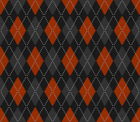 Knitted argyle Halloween pattern. Wool knitinng. Scottish plaid in orange, black and grey rhombuses. Traditional  Scottish background of diamonds . Seamless fabric texture. Vector illustration
