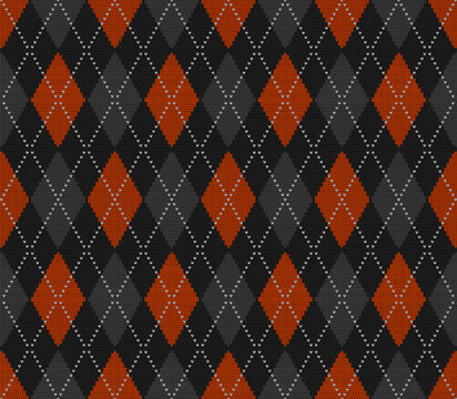 Knitted argyle Halloween pattern. Wool knitinng. Scottish plaid in orange, black and grey rhombuses. Traditional  Scottish background of diamonds . Seamless fabric texture. Vector illustration
