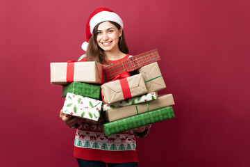 Woman with so many Christmas gifts