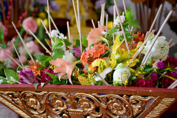 Flowers,incense,candles used to worship Buddha