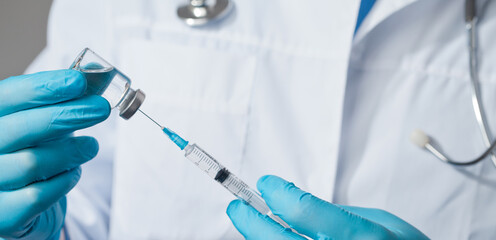 Doctor holding a viol with vaccine against corona virus.