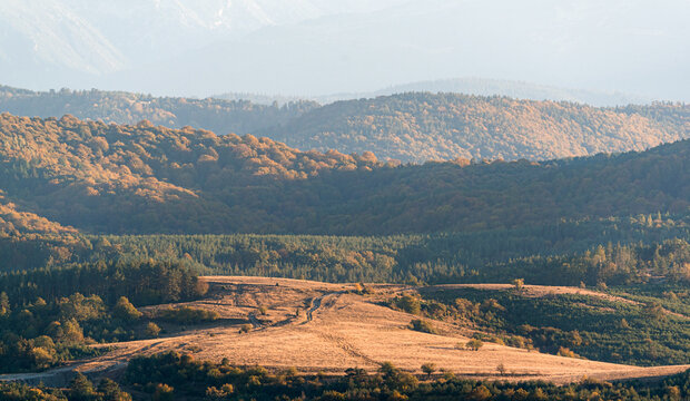clear blue air over mountains in bulgaria crops hay fields clouds blue sharp focus distance superzoom copy space for text minimal landscape rural
