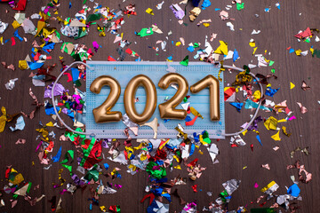 Happy new year 2021 with face mask and confetti