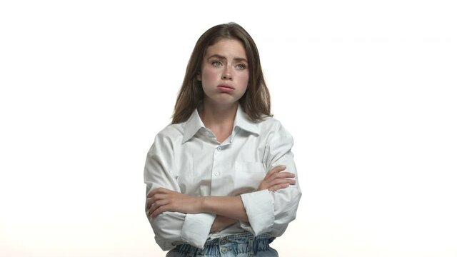 Video Of Reluctant And Bored Young Office Woman In White Shirt, Exhaling And Standing With Crossed Arms On Chest, Looking Around Unamused