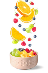 Delicious fruit salad in bowl and flying ingredients on white background