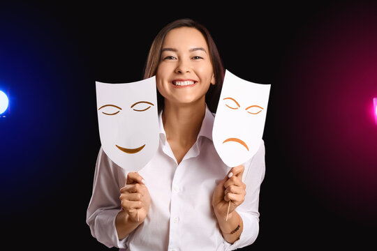 Young talented actress with different masks on dark background