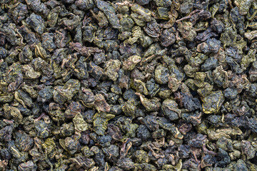 Green tea leaves background and texture, macro shot