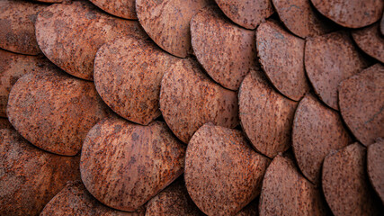 Close up textured background of rusted metal fish scale shapes - horizontal format  © Jacquie Klose