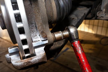 New brake disc with an anti-corrosion layer, mounted on the front hub, screwing the brake calipers...