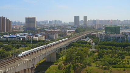 Fototapeta na wymiar aerial view of railway bridge and trian 