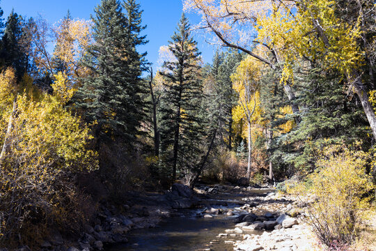 Pecos River in autumn in the Santa Fe National Forest of New Mexico is a great place to hike along the water and beautiful rocks