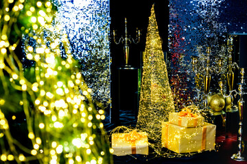 Christmas tree decorated with festive lights. Winter holiday at home. Xmas design decoration.