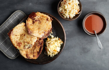 Traditional salvadoran breakfast and dinner, corn tortillas filled with pork, cheese and beans, latin america food