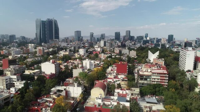 Aerial Drone View of Mexico City skyline from condesa Towers and clouds