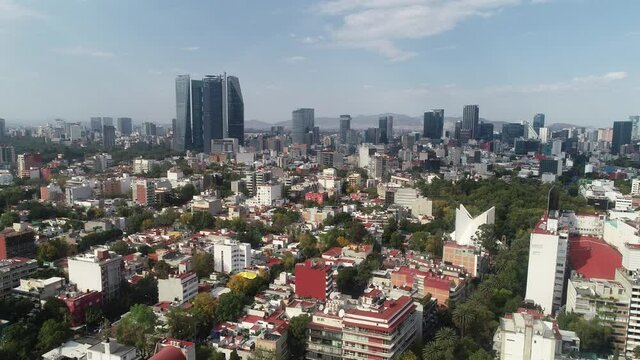 Aerial Drone View of Mexico City skyline from condesa Towers and clouds