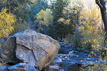 Naklejka na ściany i meble Pecos River in autumn in the Santa Fe National Forest of New Mexico is a great place to hike along the water and beautiful rocks