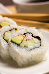 Macro Concept. Close up of set of delicious sushi california rolls on a Plate