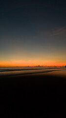 Beautiful Sunset with nice sky on black sand beach