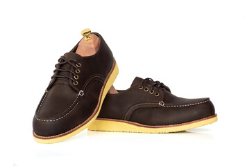 Men fashion brown shoes leather  with shoe tree (shape supporter) isolate on white background.