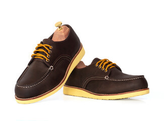 Men fashion brown shoes leather with shoe tree (shape supporter)  isolated on white background.
