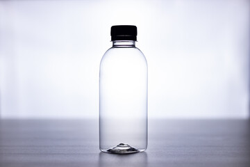 Bottle of water on black table white background