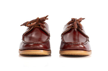 Men fashion brown leather boat shoes with shoe tree (shape supporter)  isolated on white background. Front view