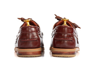 Men fashion brown leather boat shoe with shoe tree (shape supporter)  isolated on white background....