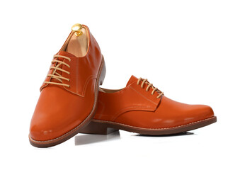 Men fashion orange shoes leather with shoe tree (shape supporter)  isolated on white background. Clipping path