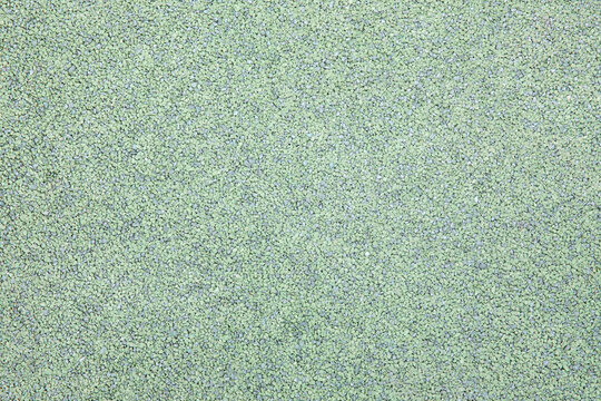 Green gravel texture or surface.