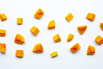 Cut and slices butternut squash on white background.