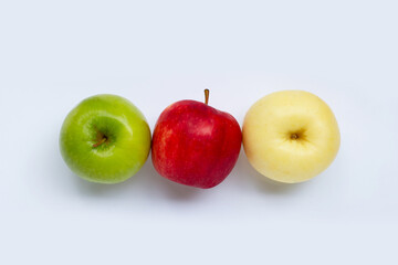 Juicy red, yellow and green apples on white