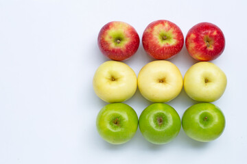 Juicy red, yellow and green apples on white