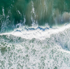 Aerial view of a wave at sunset