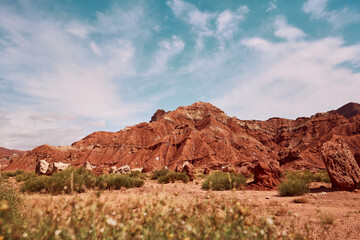 Rock mountains in desert with blue sky and cloud in high contract tune.																			