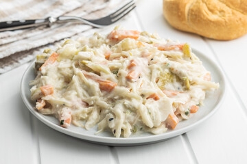 Coleslaw. Salad made of shredded white cabbage and grated carrot with mayonnaise.