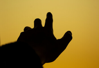 A hand reaching for the sky