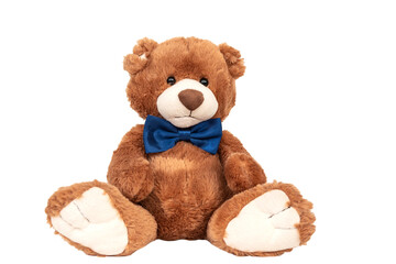 Cute funny fluffy yellow teddy bear kids favourite stuffed toy with small black plastic eyes and dark blue satin bow tie sitting isolated on white background.