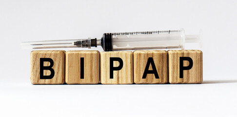 Text BIPAP made from wooden cubes. White background